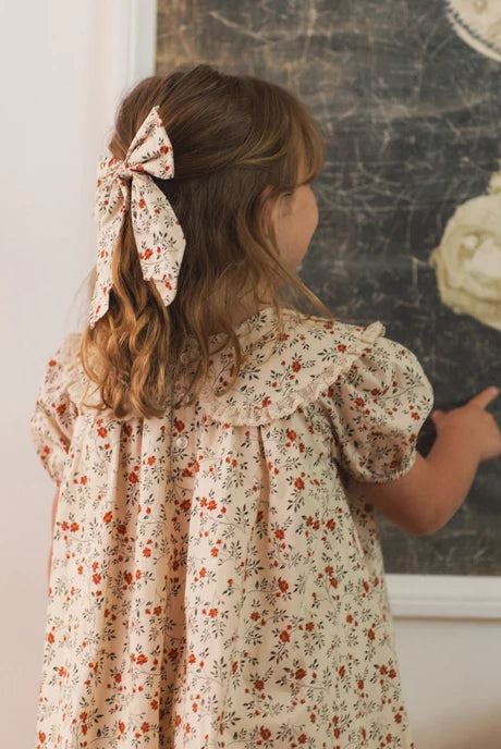 Girl wearing the Noralee Everly Bow | Holly Vines, rear view