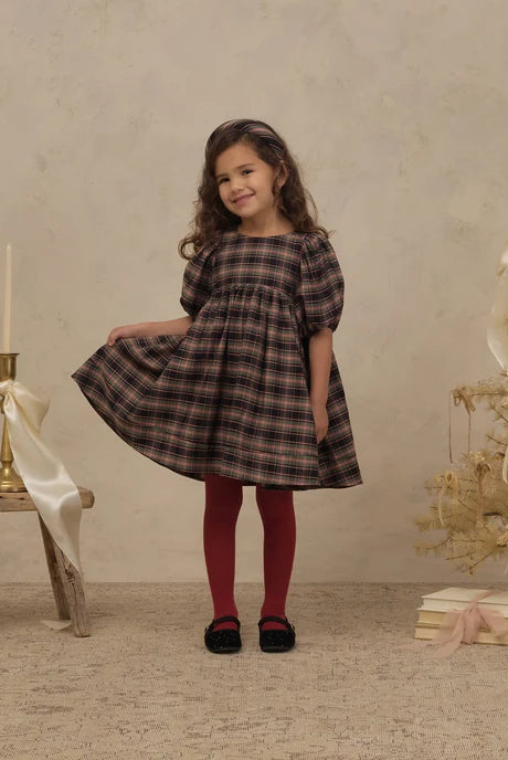 Girl in Noralee Shimmer Tights in Ruby
