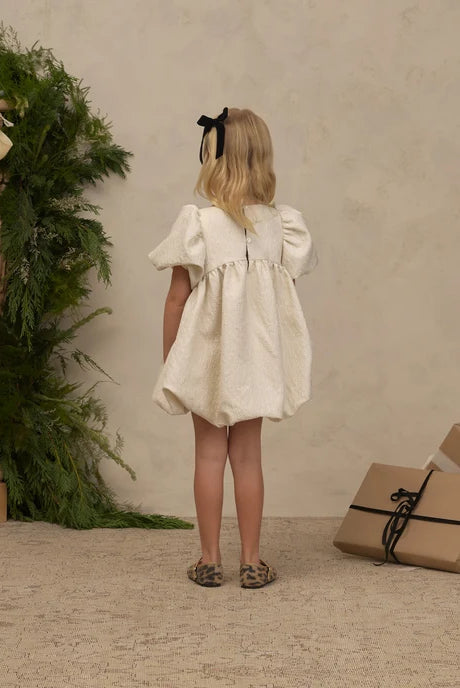 Rear view of a girl wearing the Noralee Velvet Bows Set | Black, Ivory, styling the "black" color