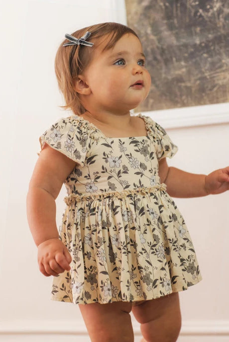 Baby girl modeling Mini Ribbon Bows | Green, Ruby in "Green"