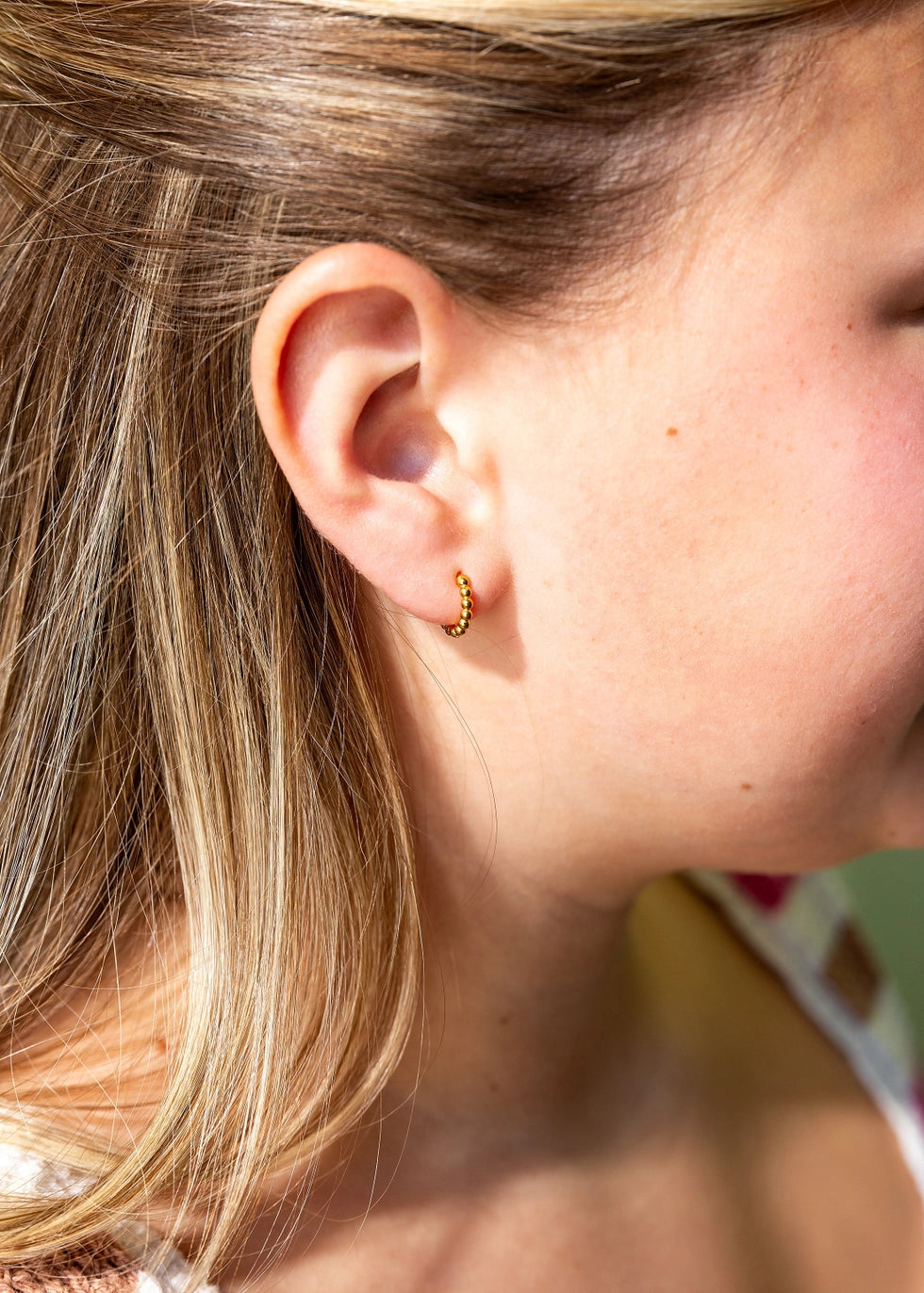 Pierced Co. Tiny Dot Huggies worn by model