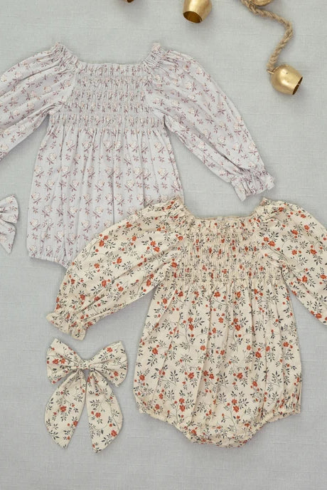 Styled flat lay of Noralee Everly Bow | Holly Vines