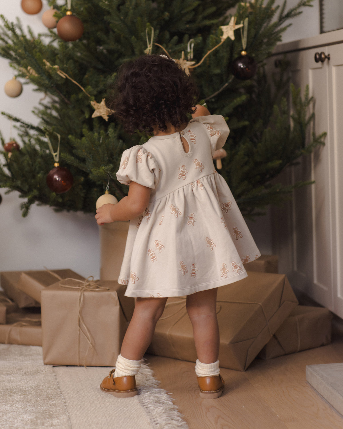 Quincy Mae Darla Dress in Gingerbread back to camera lifestyle model photo