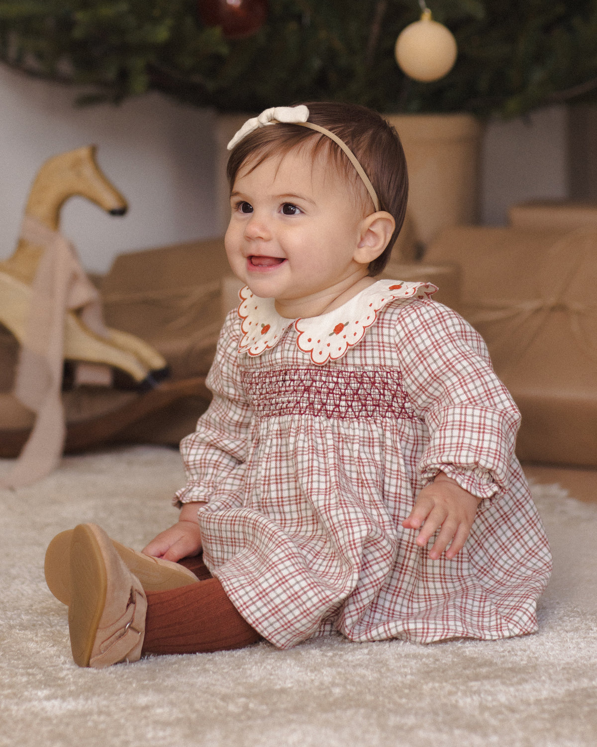 Quincy Mae Baby Callie Dress in Christmas Plaid lifestyle model portrait