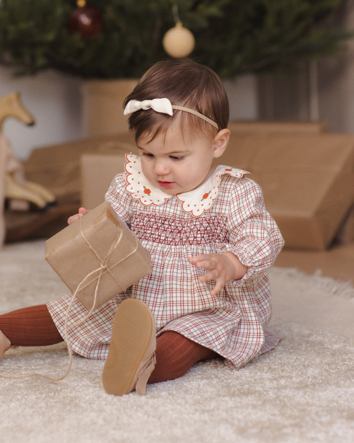 Quincy Mae Baby Callie Dress in Christmas Plaid studio baby model photo