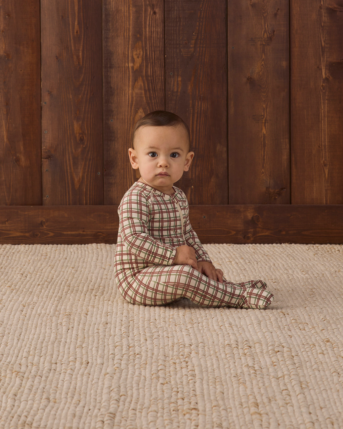 Quincy Mae Bamboo Baby Zip Footie in Redwood Check baby studio model