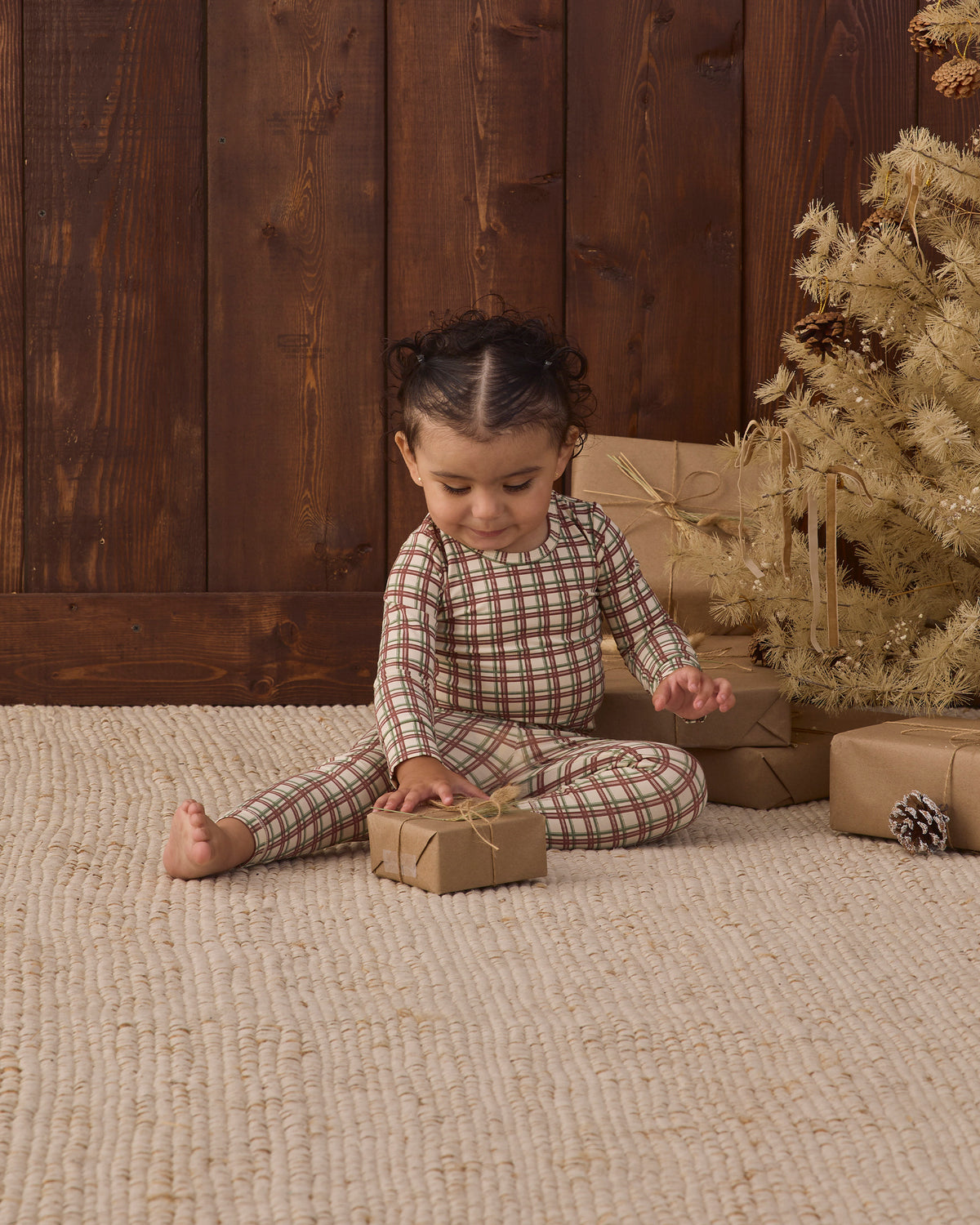 Quincy Mae Baby Bamboo Pajama Set in Redwood Check styled studio model photo
