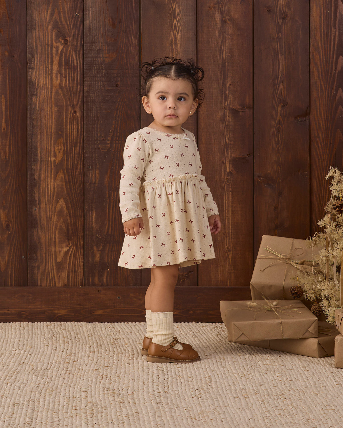 Quincy Mae Alda Dress in Red Bows full length 3/4 profile model photo