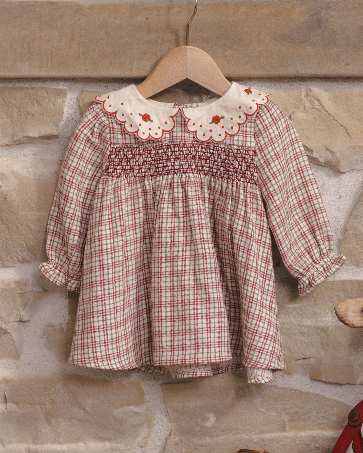 Styled Quincy Mae Baby Callie Dress in Christmas Plaid on Hanger