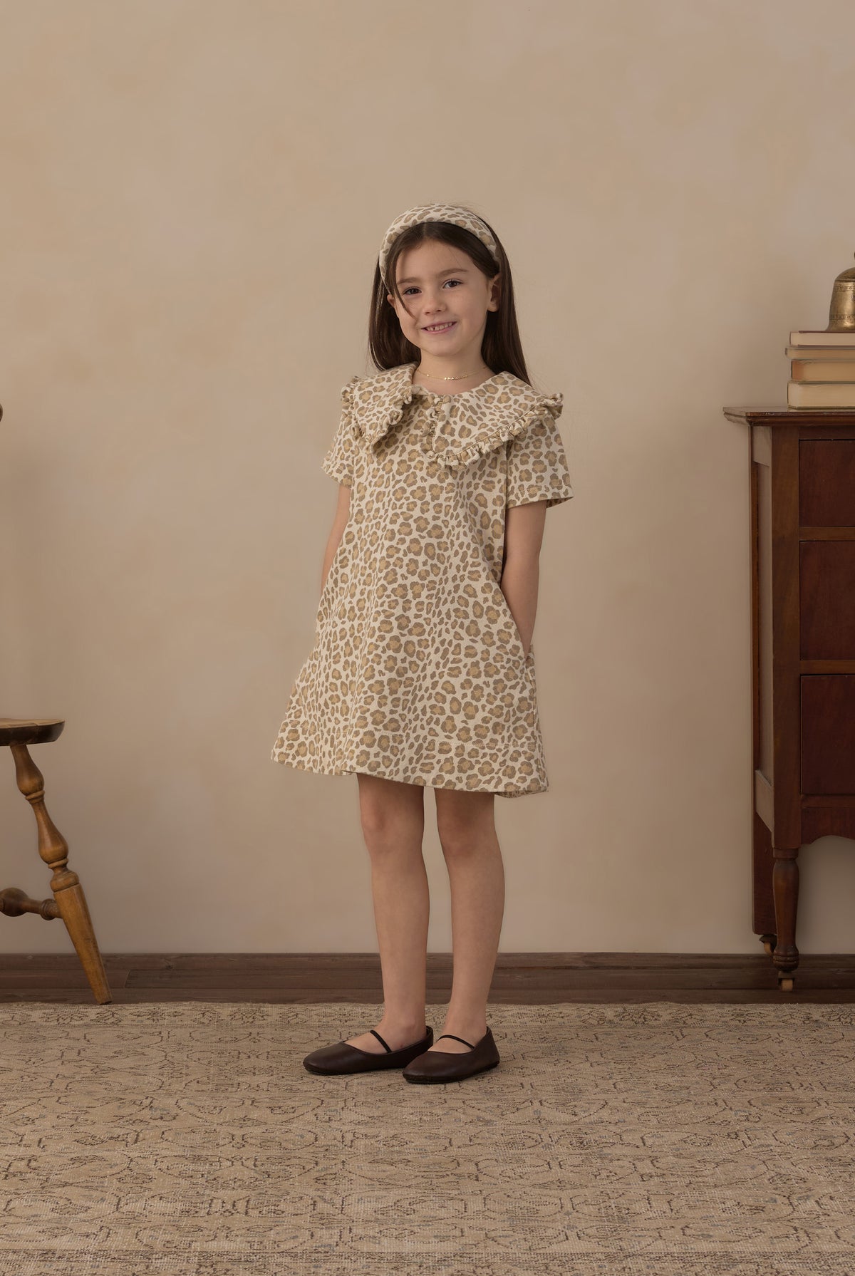 Model wearing the girls's Rylee + Cru Girls Collard Denim Mini Dress | Leopard