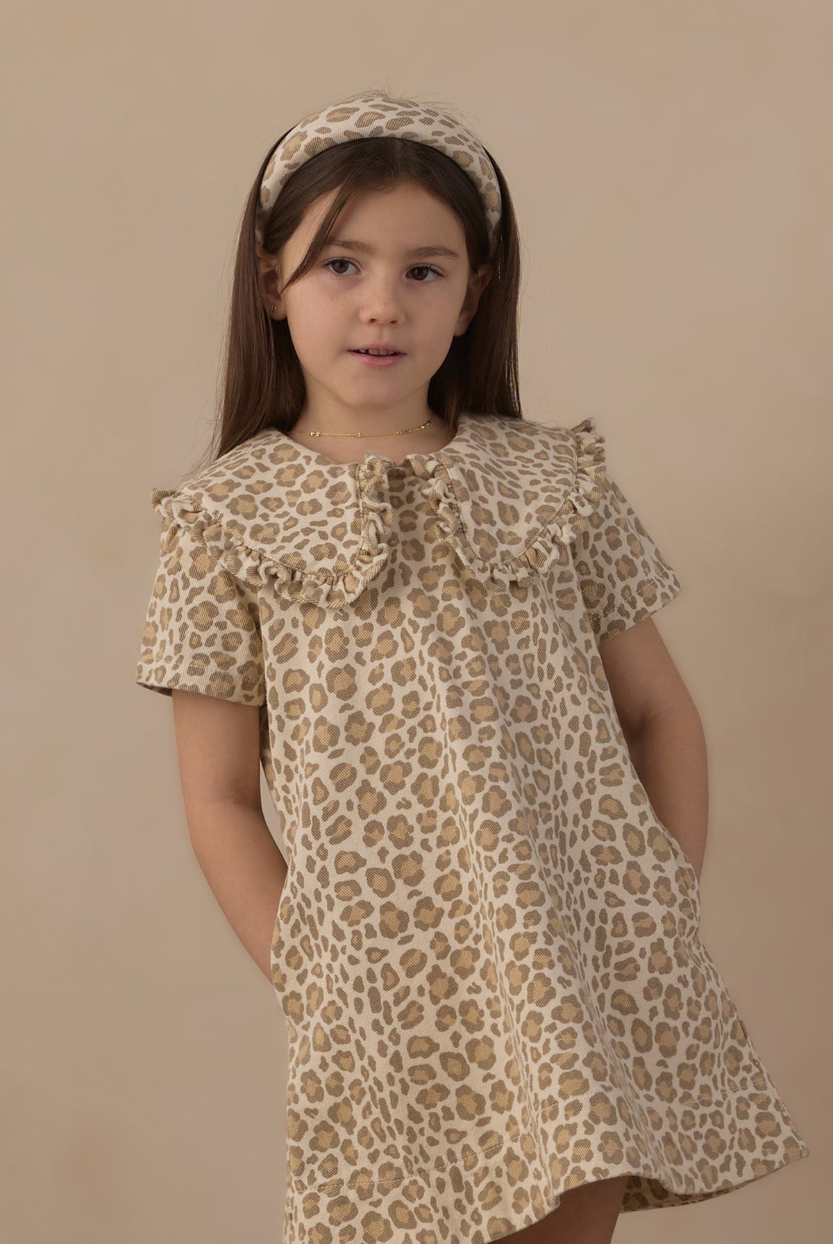 Girl wearing the Rylee + Cru Girls Collard Denim Mini Dress | Leopard and matching headband