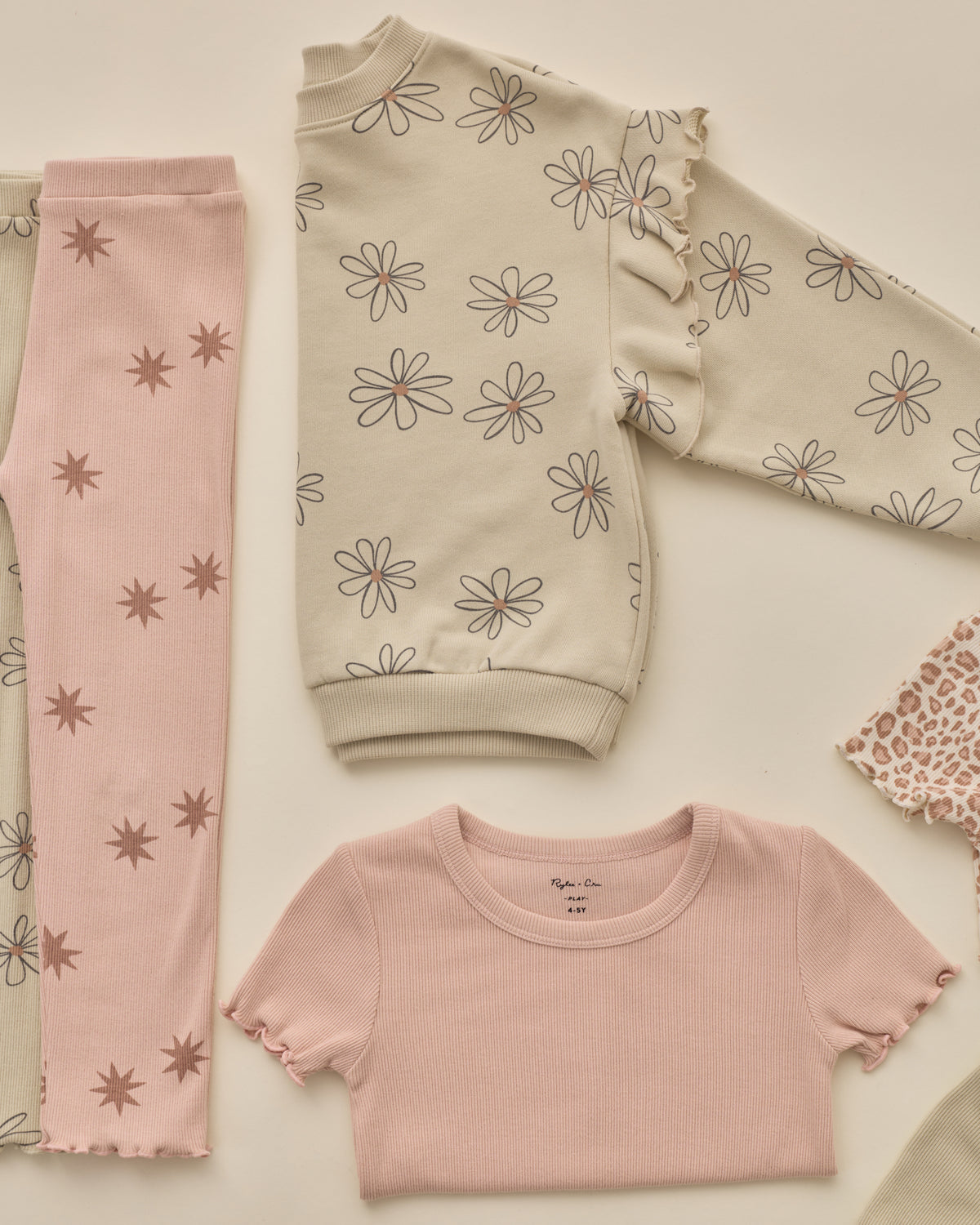 Styled flat lay of the Ruffle Sweatshirt | Big Daisy from Rylee + Cru and Rylee + Cru AW '26 Play Collection