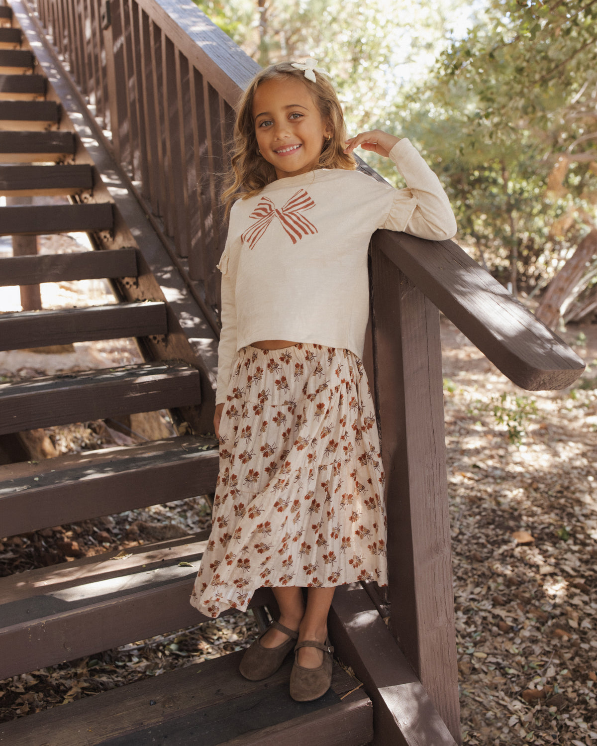 Rylee + Cru Girl's Ruffle Long Sleeve Tee | Bow Model Lifestyle Photo