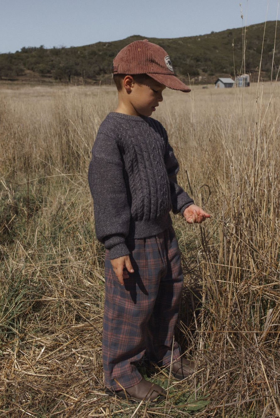 3/4 side view of boy modeling the Rylee + Cru Aspen Sweater | Midnight