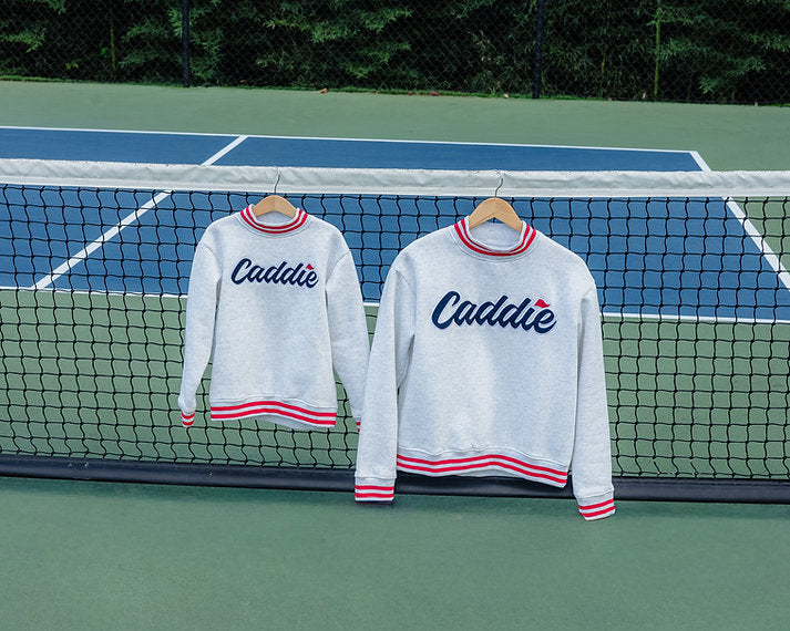 Family matching Caddie styles featuring Youth Caddie Logo Mockneck Pullover Sweatshirt and Women's Caddie Logo Mockneck Sweatshirt Pullover
