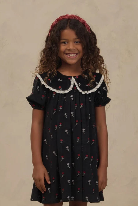 Girl in dress wearing the Noralee Braided Headband | Ruby