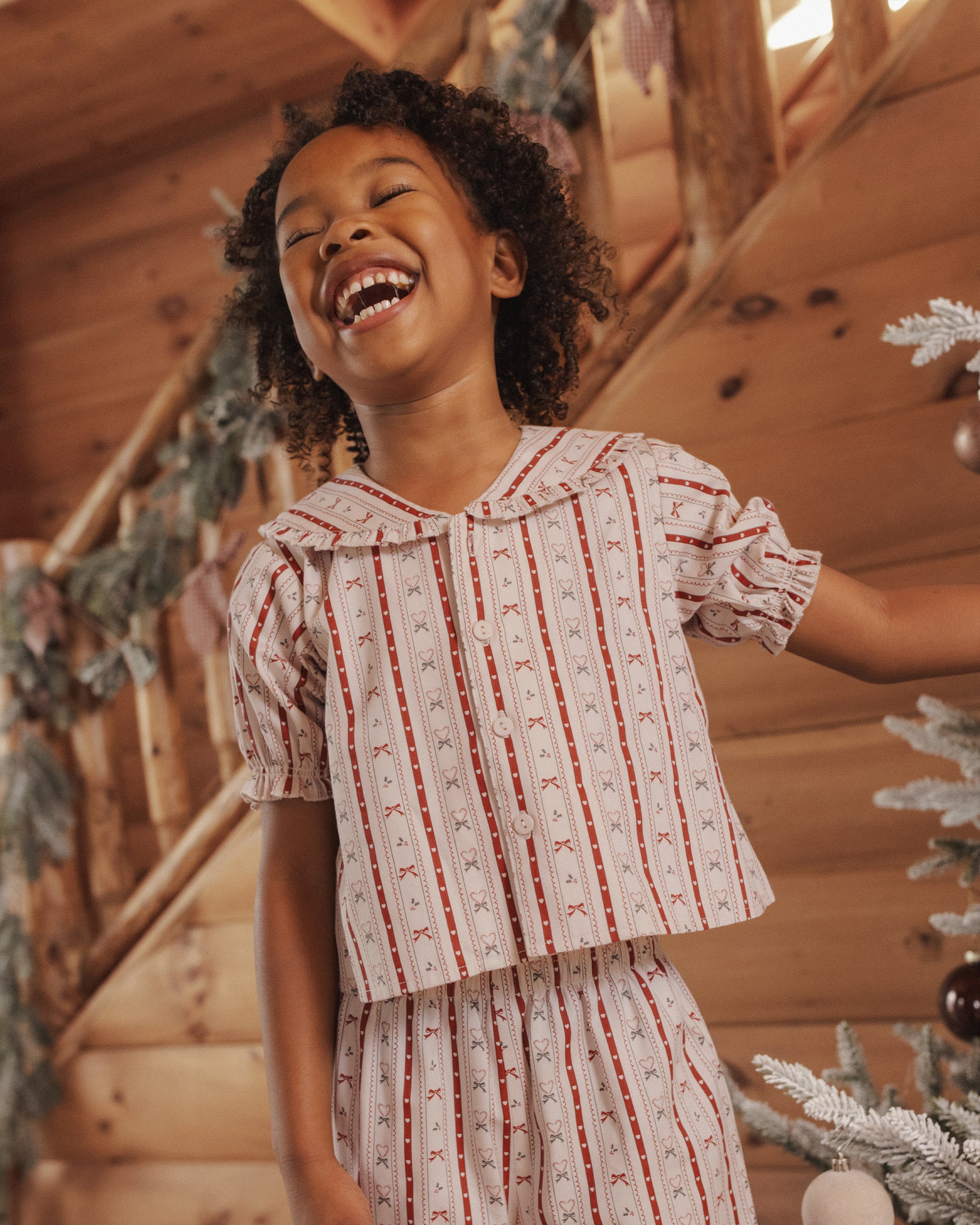 Rylee + Cru Girl's Ruffle Pajamas | Candycane Lane Lifestyle Model Portrait