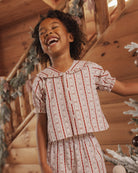 Rylee + Cru Girl's Ruffle Pajamas | Candycane Lane Lifestyle Model Portrait