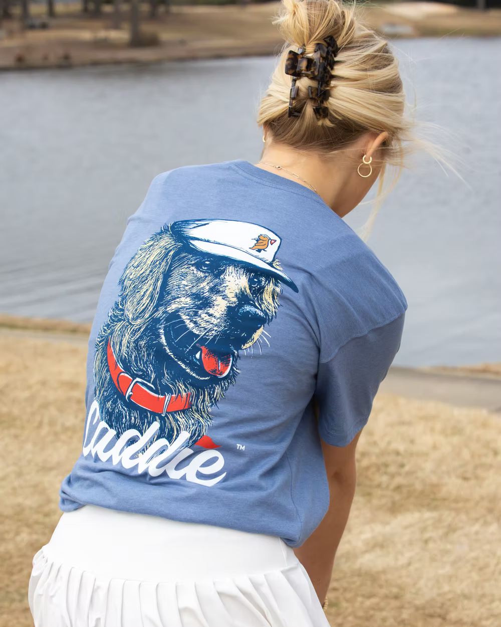 Back to camera angle of girl wearing Caddie Retriever Pro Tee in Saltwater Blue RC117Y lifestyle photo