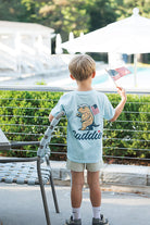 Caddie "Old Glory" Tee | Chambray model back to camera angle 
