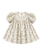 Quincy Mae Carina Baby Dress in Holiday Floral flat lay