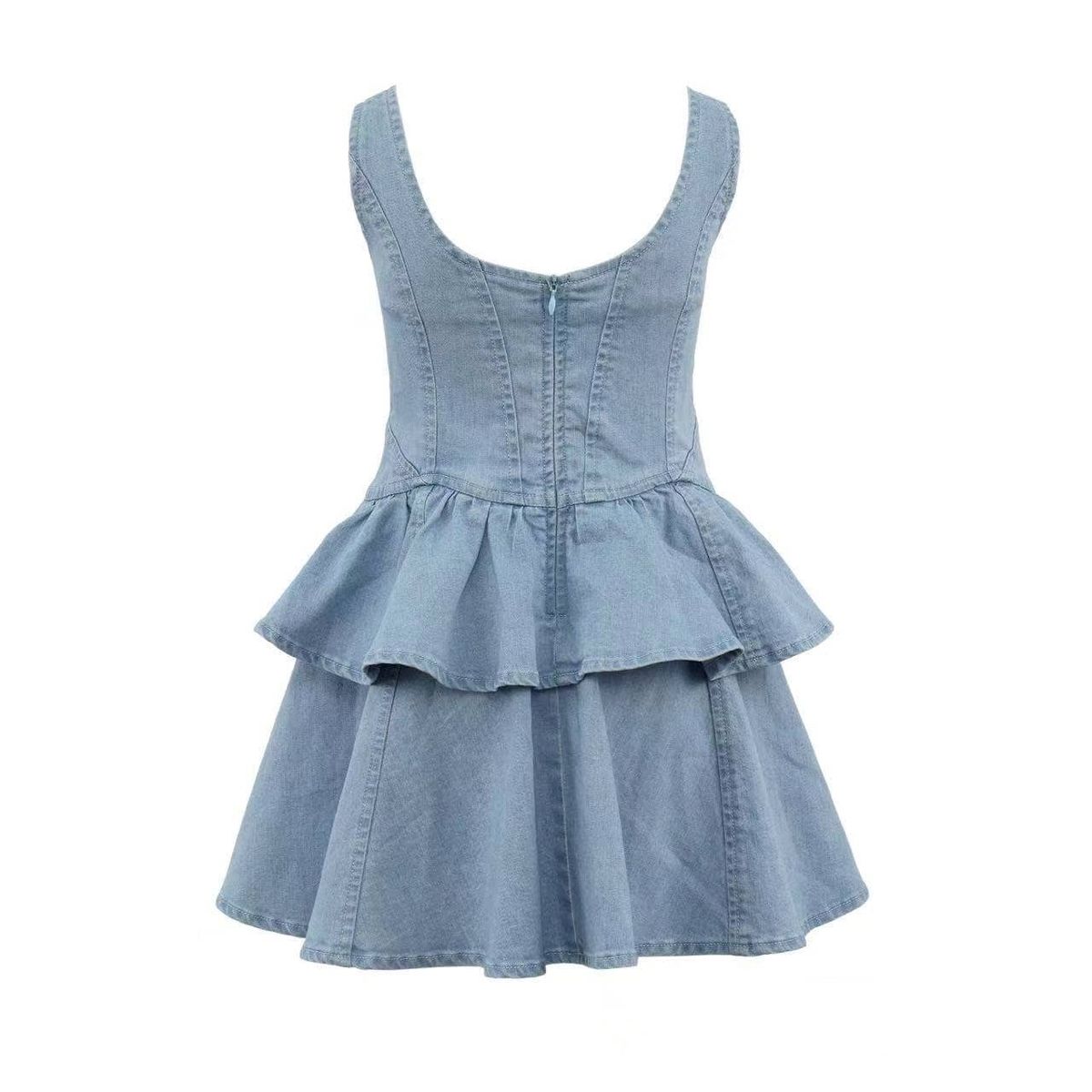 A light blue denim sleeveless dress with a corset-style bodice, ruffled peplum waist, and tiered skirt, shown against a plain white background.