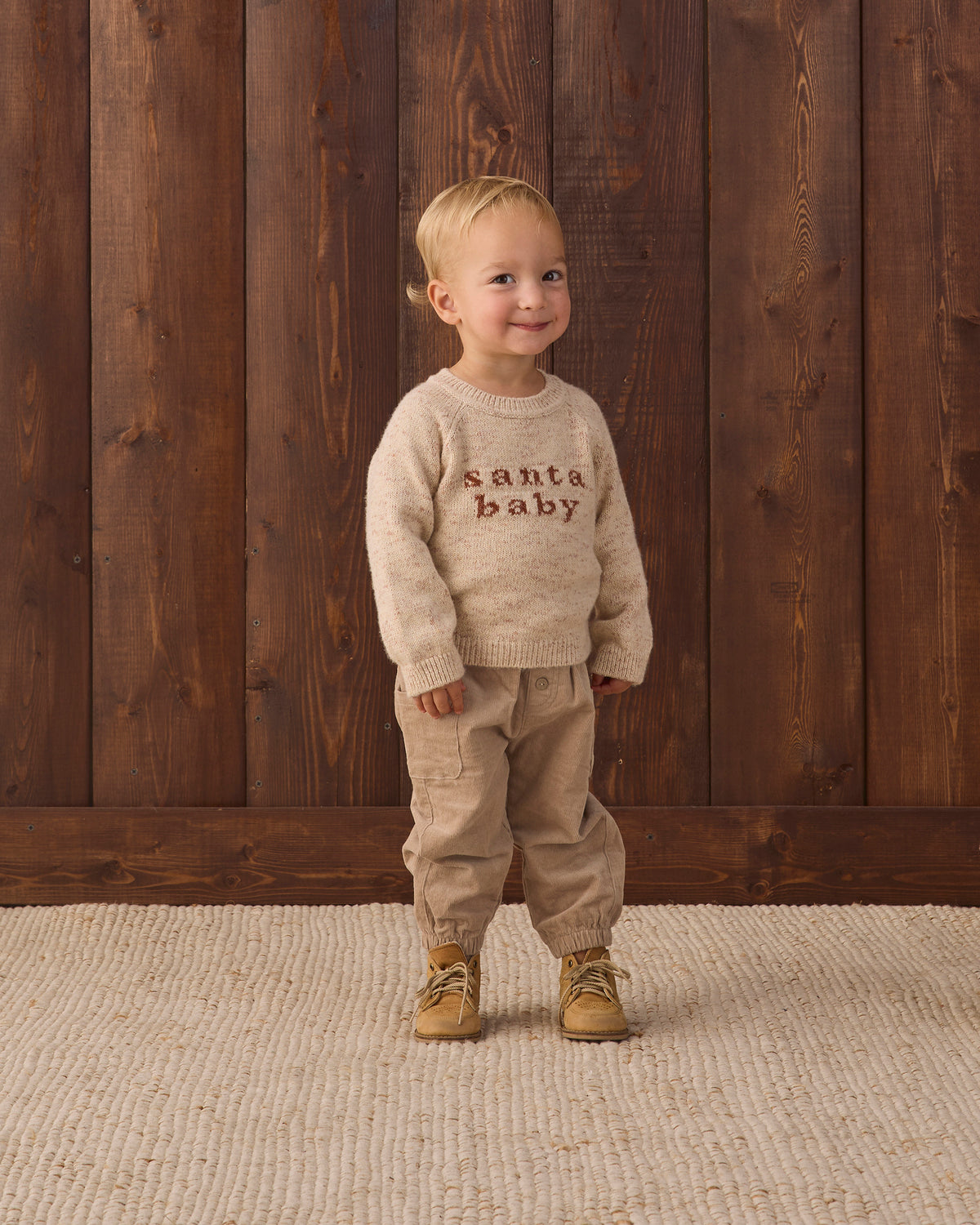 baby boy Knit Baby Toddler Sweater in Santa Baby and Quincy Mae Luca Pant in Latte studio model full length photo