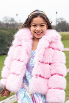 Girl outdoors modeling the Lola and the Boys Cotton Candy Gem Faux Fur