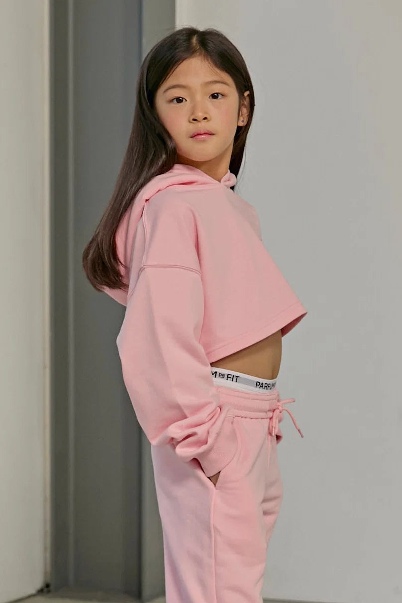 Side view of model wearing the Parfum de Fit Vive Parfum Crop Hoodie