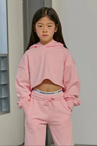Model wearing the Parfum de Fit Vive Parfum Crop Hoodie