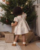 Quincy Mae Darla Dress in Gingerbread back to camera lifestyle model photo