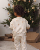 Quincy Mae Relaxed Fleece Baby Sweatpant in Gingerbread and Quincy Mae Relaxed Fleece Baby Sweatshirt in Gingerbread full length lifestyle model back to camera photo