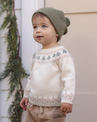 Toddler model wearing Quincy Mae Baby Rex Sweater in Tree Fair Isle and Quincy Mae Beanie in Spruce portrait photo