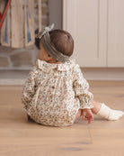 Quincy Mae Callie Romper in Holiday Floral styled model back to camera angle