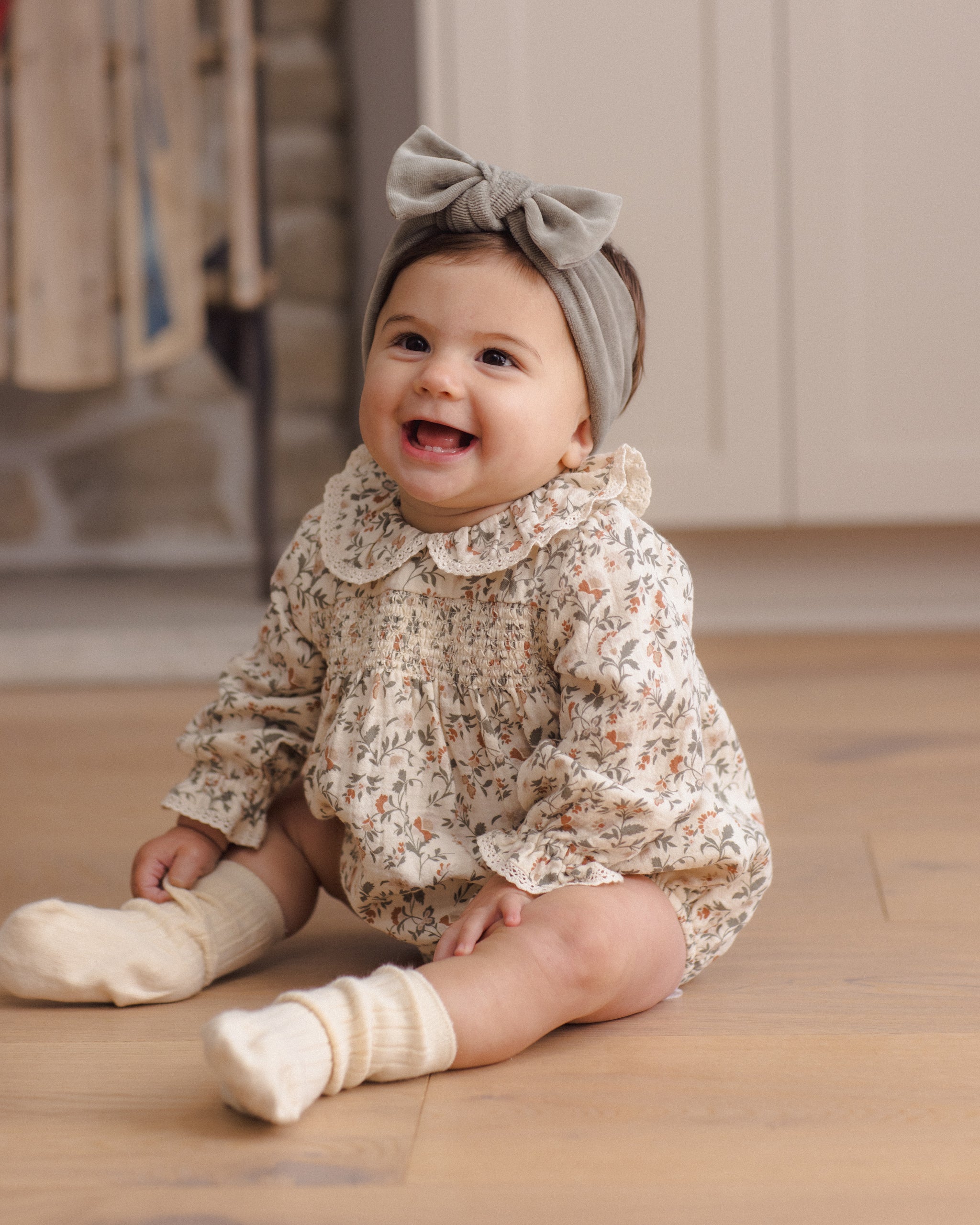 Quincy Mae Callie Romper in Holiday Floral full length lifestyle model photo