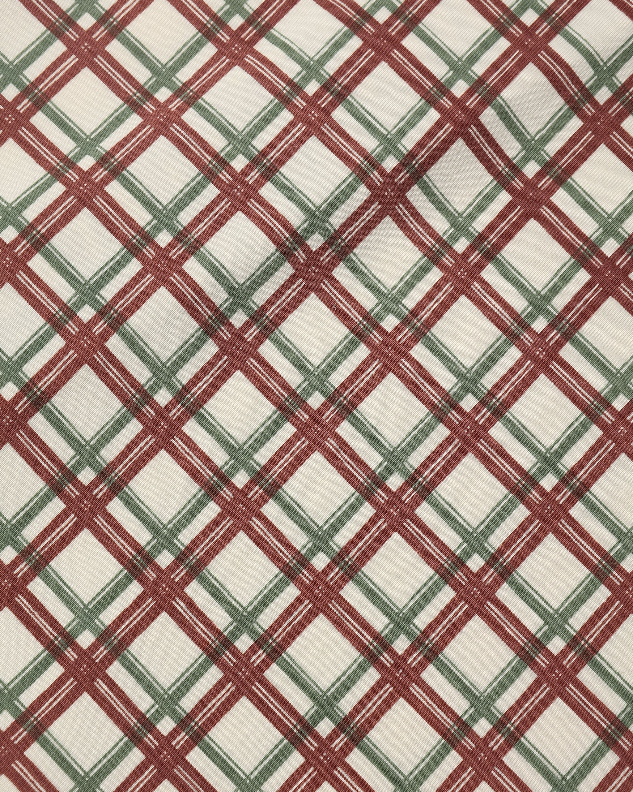 Close up details photo of Quincy Mae AW26 "Redwood Check" pattern