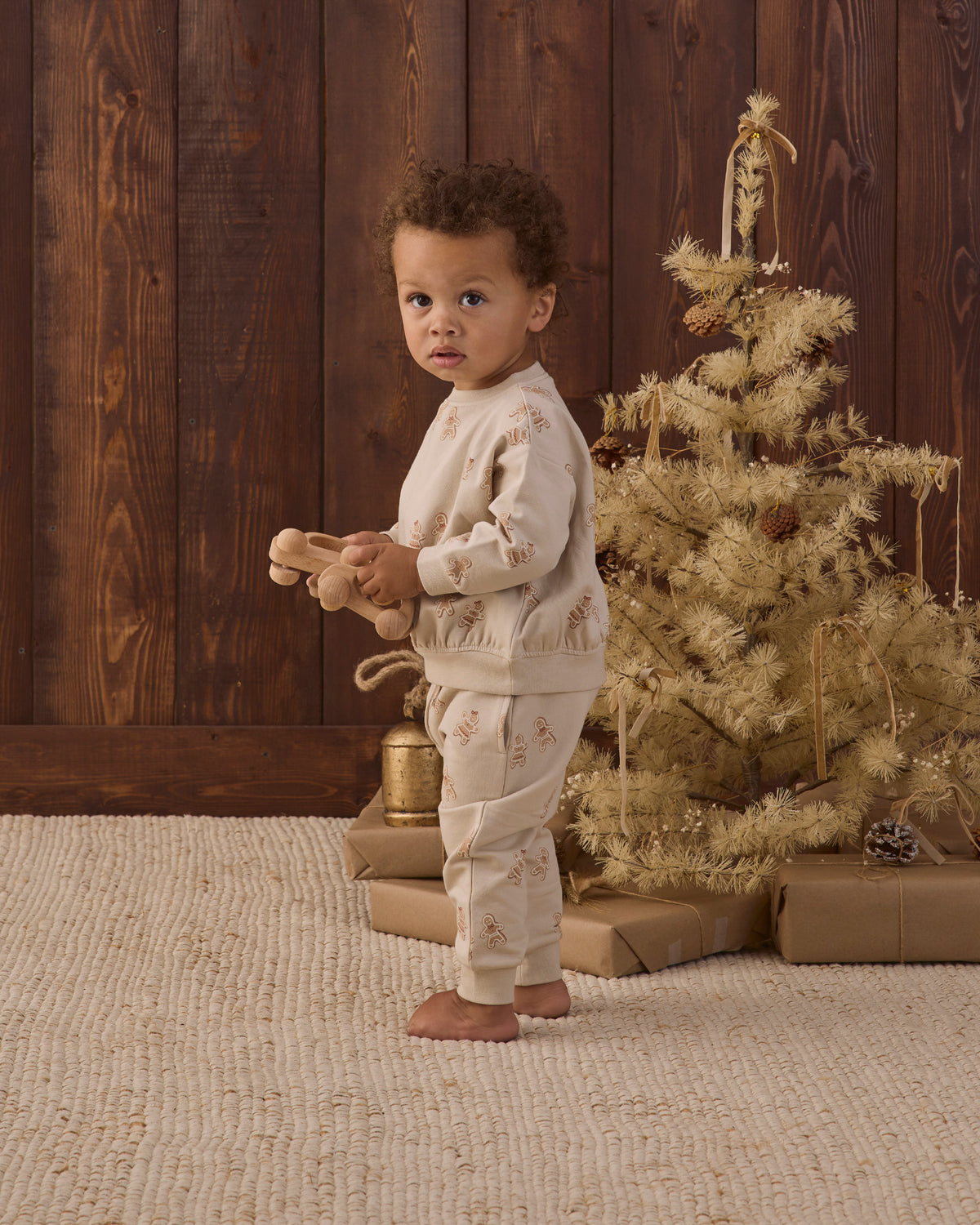 Quincy Mae Relaxed Fleece Baby Sweatshirt in Gingerbread and Quincy Mae Relaxed Fleece Baby Sweatpant in Gingerbread full length studio model side angle photo