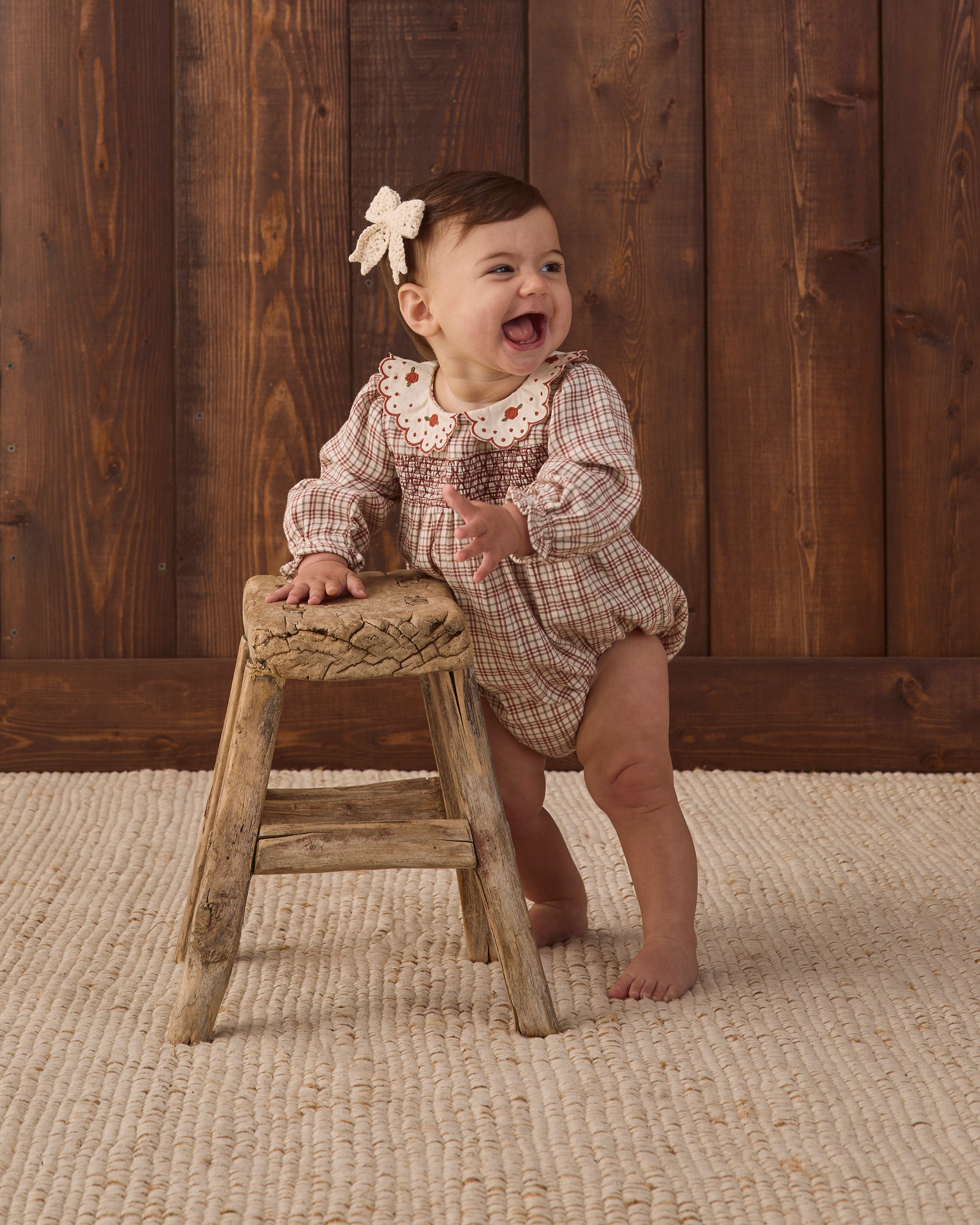 Quincy Mae Baby Callie Romper in Christmas Plaid styled studio model photo
