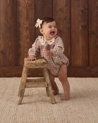 Quincy Mae Baby Callie Romper in Christmas Plaid styled studio model photo