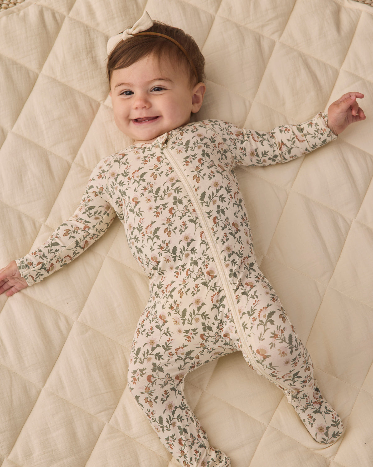 Quincy Mae Baby Bamboo Zip Footie in Holiday Floral Studio Model Styled Photo