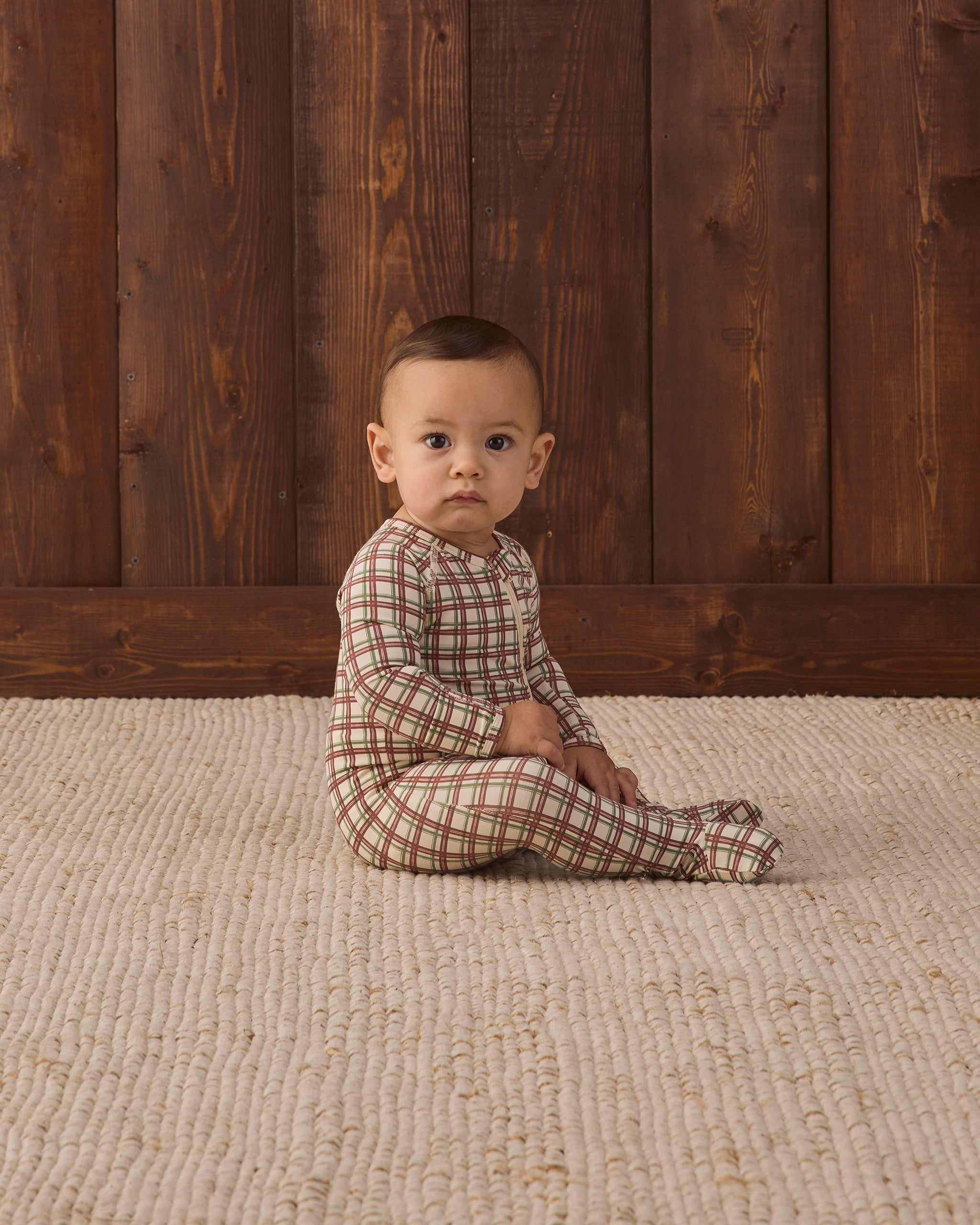 Quincy Mae Bamboo Baby Zip Footie in Redwood Check baby studio model