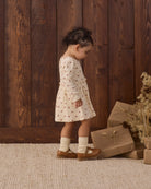 Styled baby girl wearing Quincy Mae Socks Set in "Natural" studio model photo