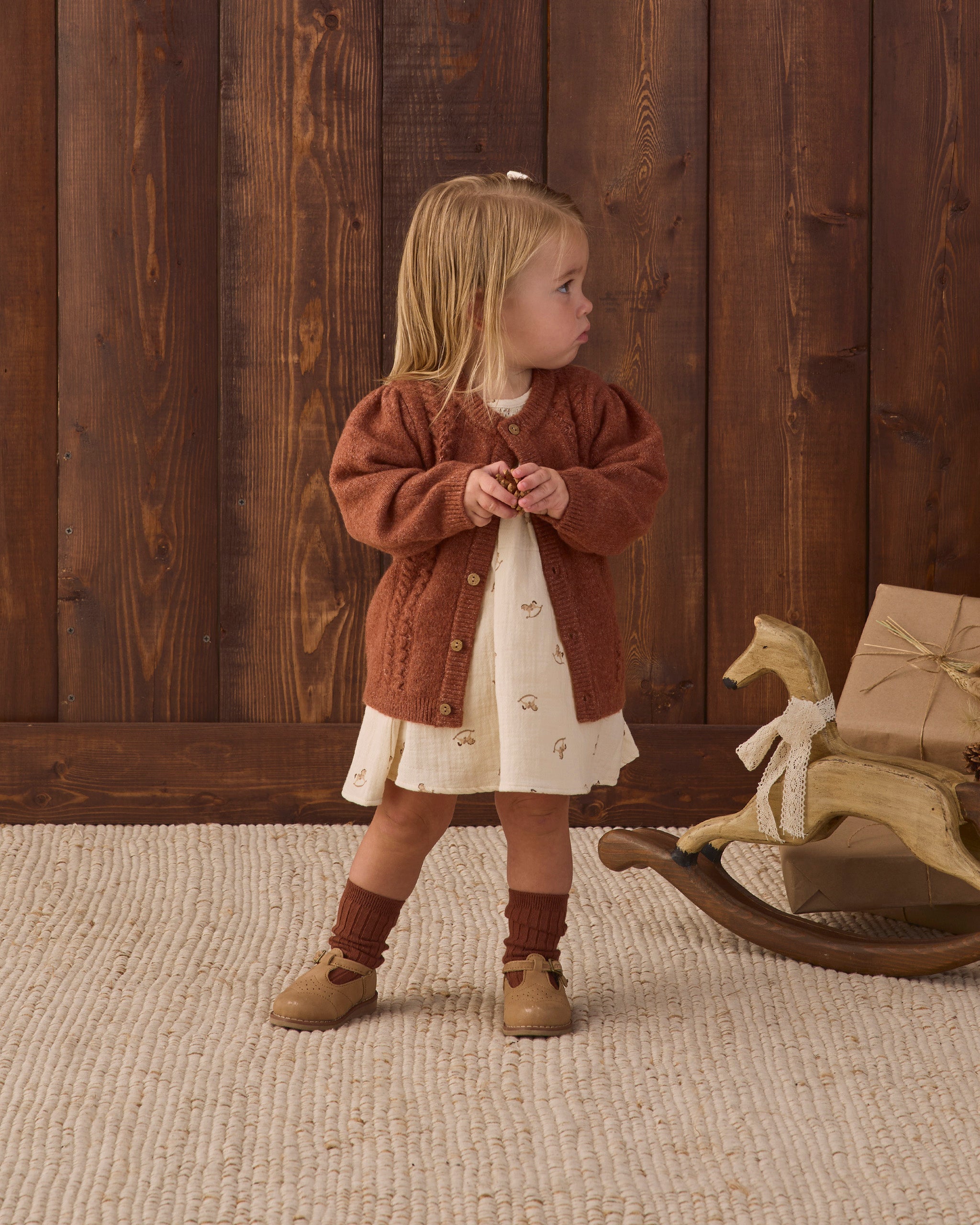 Styled baby girl wearing Quincy Mae Socks Set in "Redwood" studio model photo
