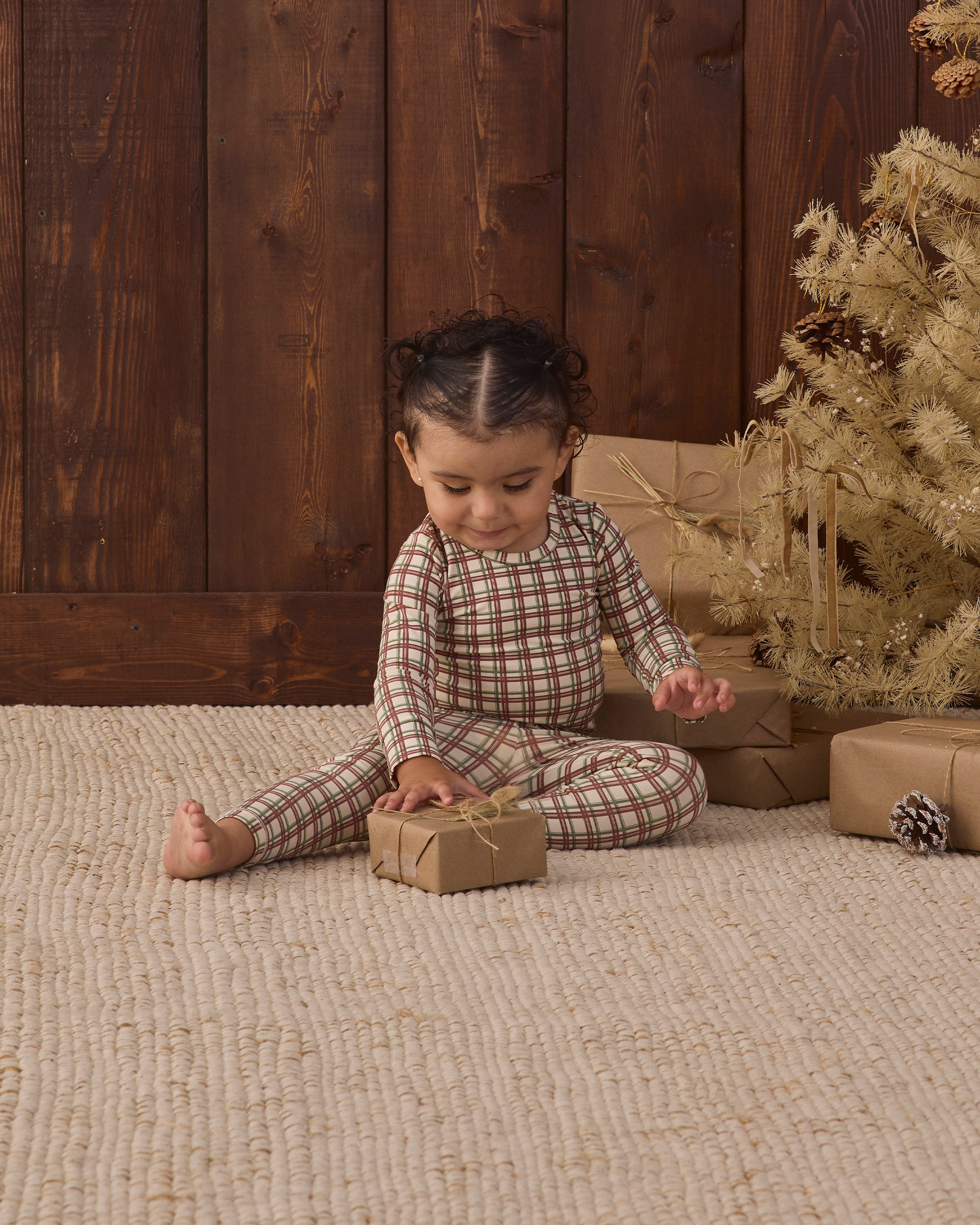 Quincy Mae Baby Bamboo Pajama Set in Redwood Check styled studio model photo