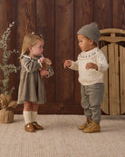 Toddler model wearing Quincy Mae Baby Rex Sweater in Tree Fair Isle Luca Pant in Spruce Beanie in Spruce studio model family matching styles