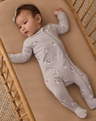 Baby girl model in Quincy Mae Baby Bamboo Zip Footie in Snowman