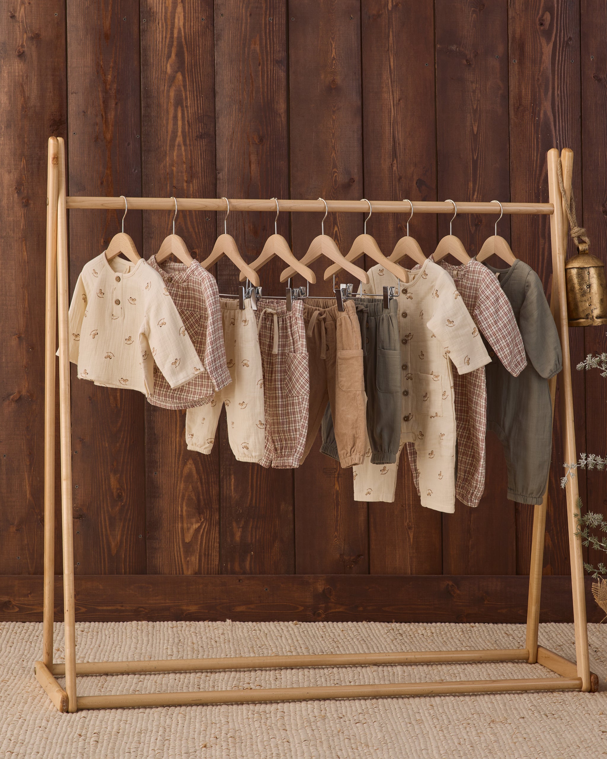 Quincy Mae AW26 Drop 3 Styled Rack Studio Photos featuring Quincy Mae Woven Baby Jumpsuit in Christmas Plaid