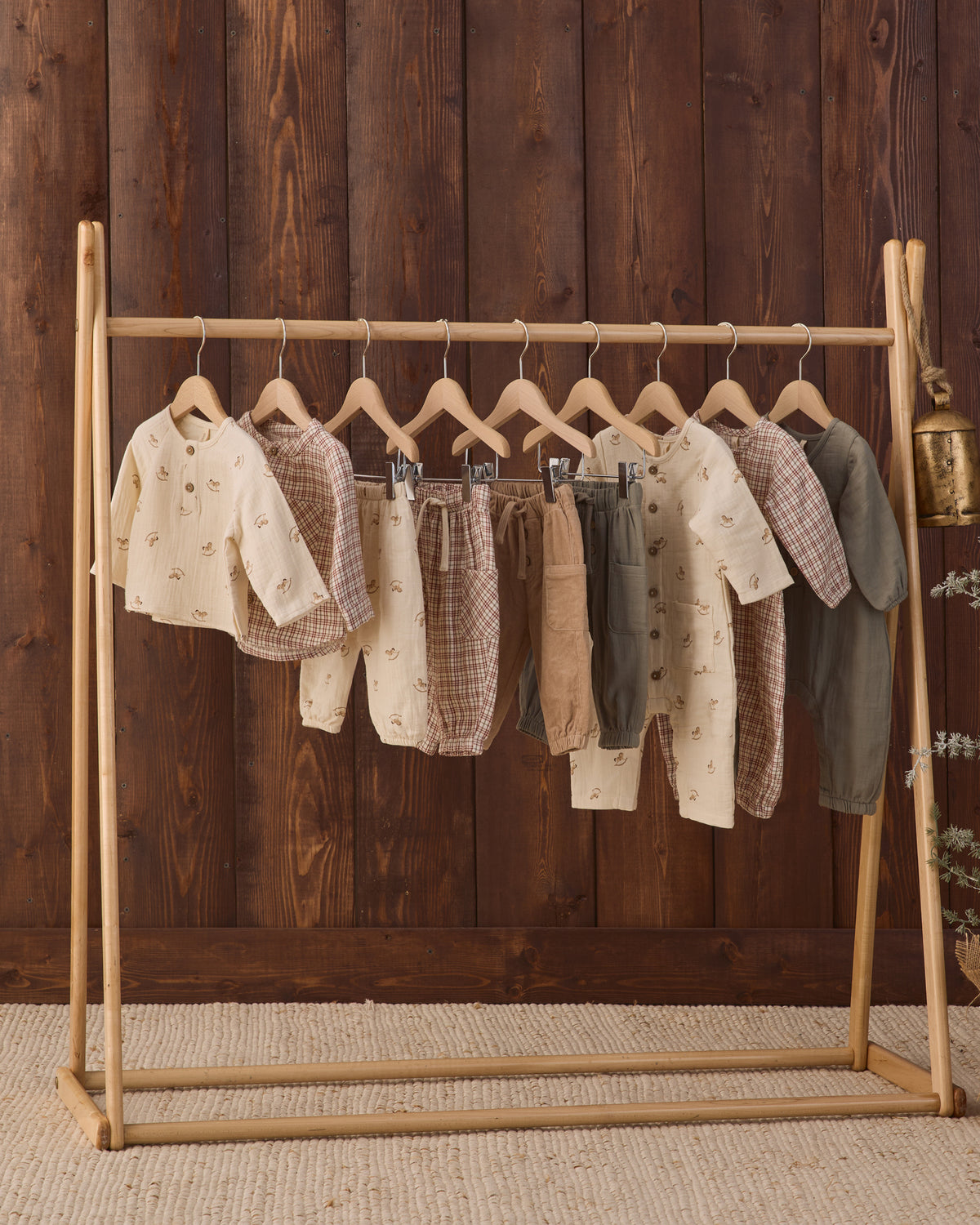 Quincy Mae AW26 Drop 3 Styled Rack Studio Photos featuring Quincy Mae Woven Baby Jumpsuit in Christmas Plaid