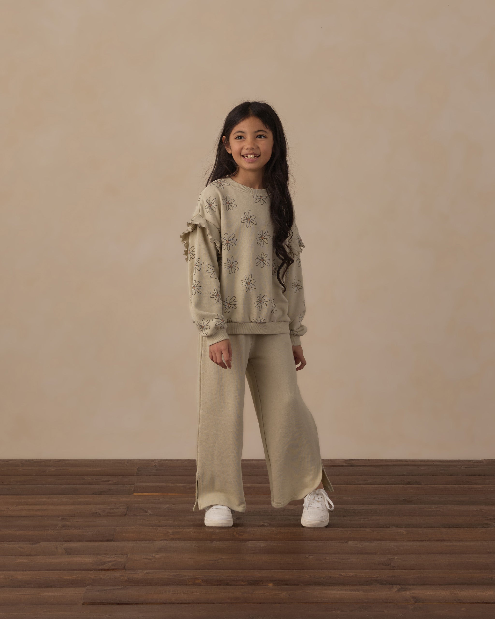 Girl modeling the Ruffle Sweatshirt | Big Daisy from Rylee + Cru