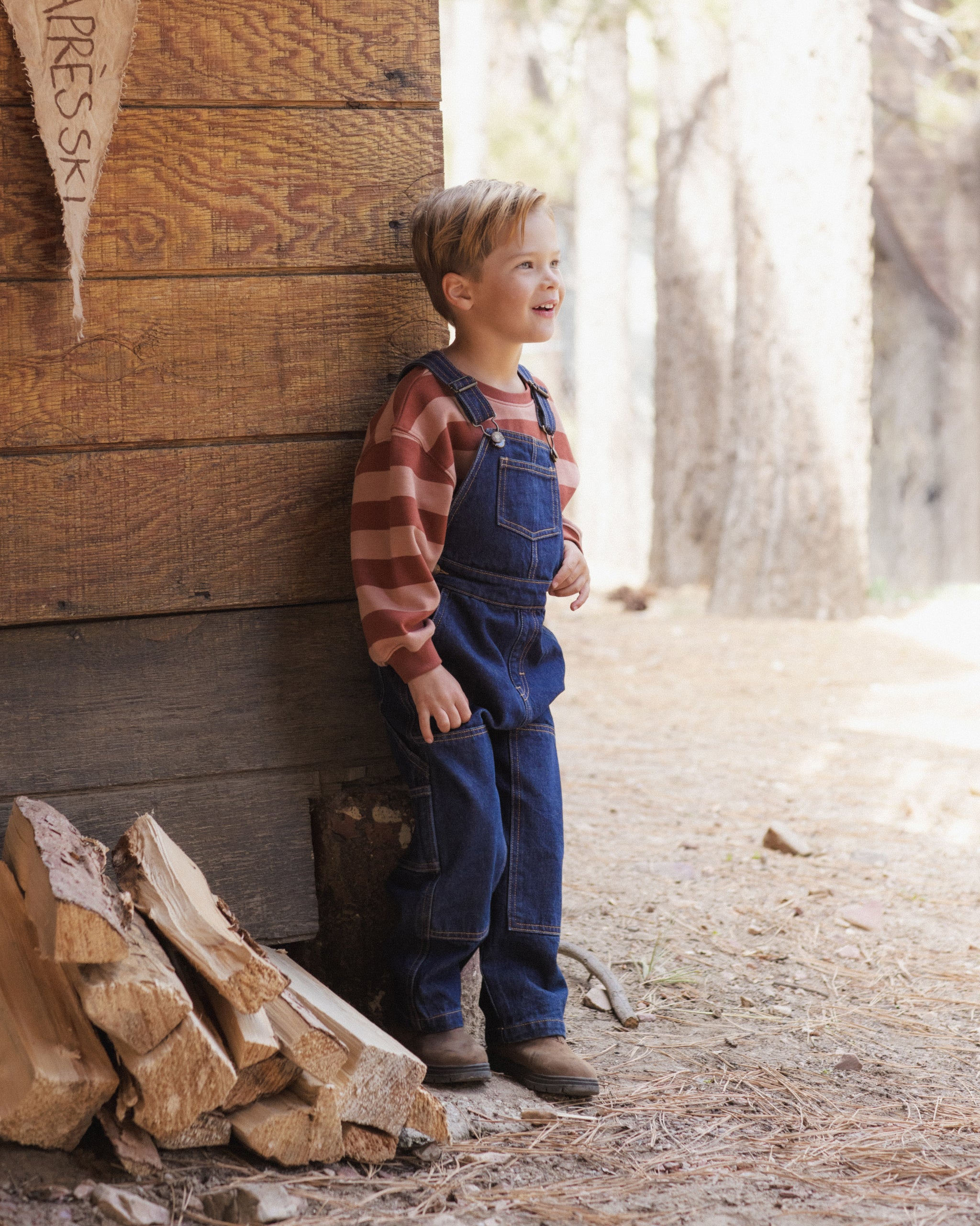 Young boy modeling the Rylee + Cru Oversized Sweatshirt | Brick + Clay Stripe